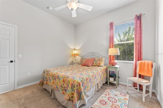 bedroom featuring ceiling fan and light carpet