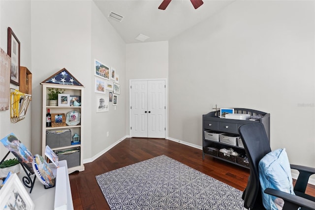 office with ceiling fan, dark wood-type flooring, and high vaulted ceiling