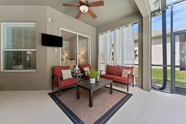 sunroom featuring ceiling fan