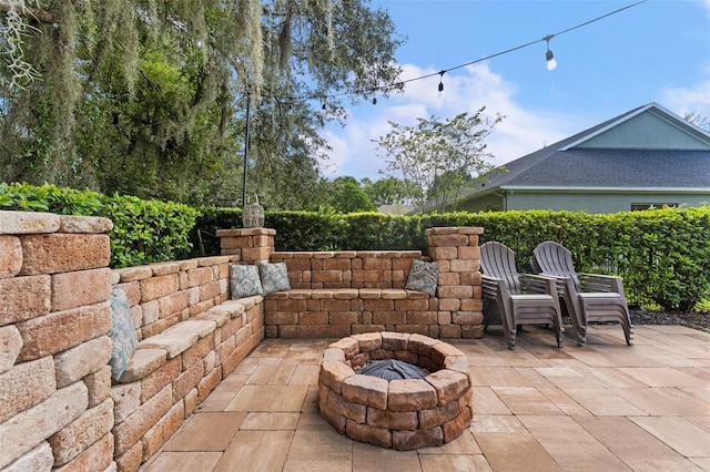 view of patio / terrace with an outdoor fire pit