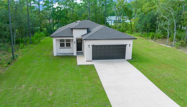 view of front of home featuring a front yard and a garage