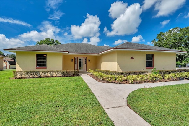 single story home featuring a front yard