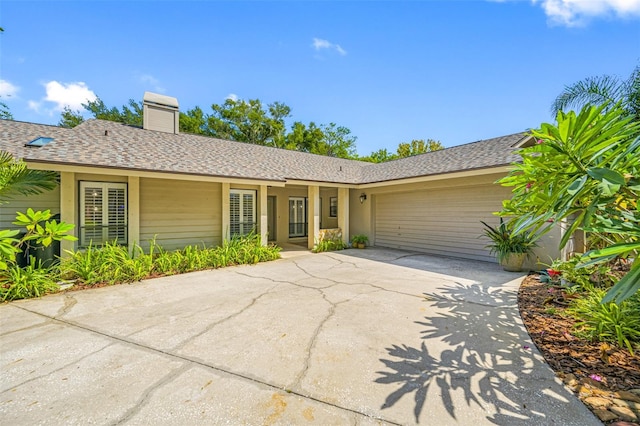 ranch-style home featuring a garage