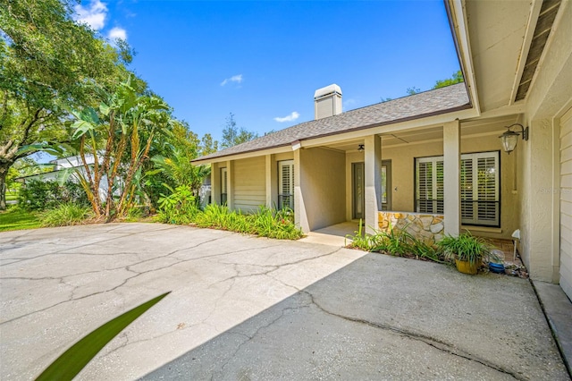 doorway to property featuring a patio area