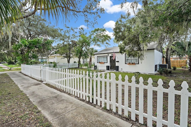 ranch-style house featuring central AC unit