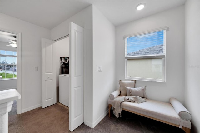 sitting room with ceiling fan and carpet floors