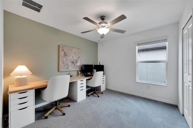 home office featuring ceiling fan and light carpet