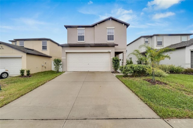 front of property with a garage and a front lawn