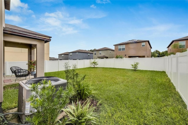 view of yard featuring a patio and central AC unit