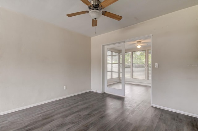 spare room featuring ceiling fan and dark wood-type flooring