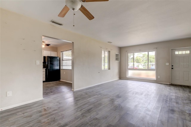 unfurnished living room featuring hardwood / wood-style flooring