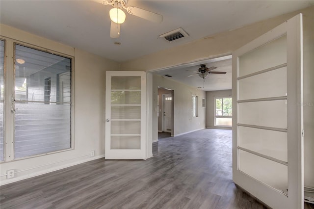 spare room with ceiling fan, hardwood / wood-style flooring, and french doors