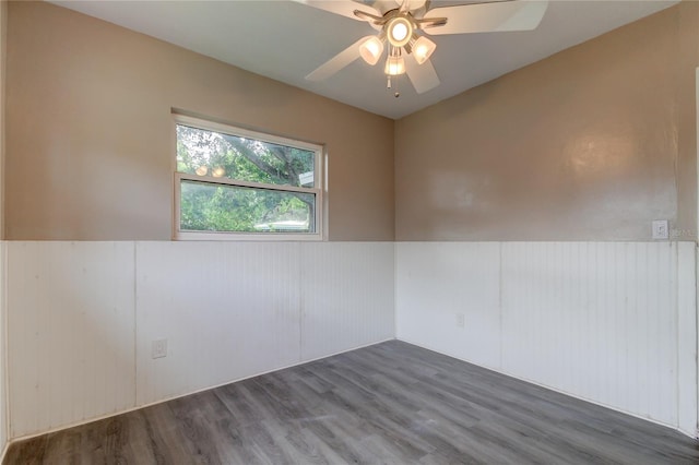 spare room with ceiling fan and dark hardwood / wood-style flooring