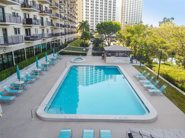 view of swimming pool featuring a patio and a gazebo