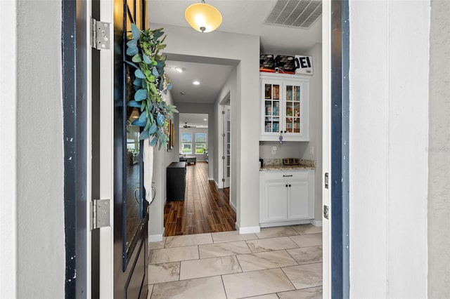 corridor featuring light hardwood / wood-style floors