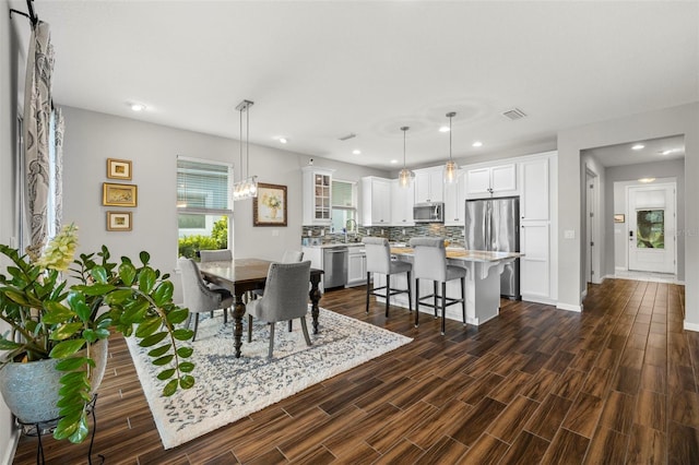 dining area featuring dark hardwood / wood-style flooring