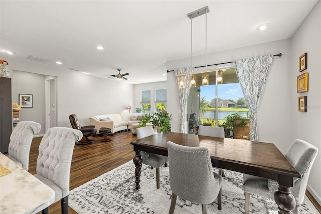 dining space featuring hardwood / wood-style flooring and ceiling fan