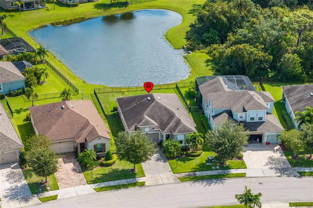 birds eye view of property featuring a water view