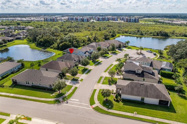 birds eye view of property featuring a water view