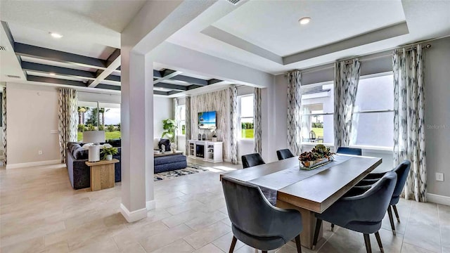 tiled dining area with coffered ceiling, plenty of natural light, and beam ceiling