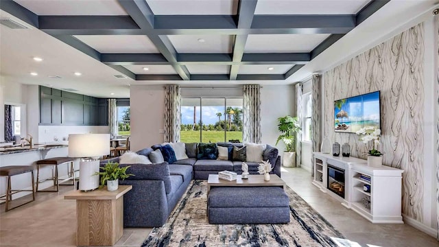 tiled living room with coffered ceiling, beamed ceiling, and plenty of natural light