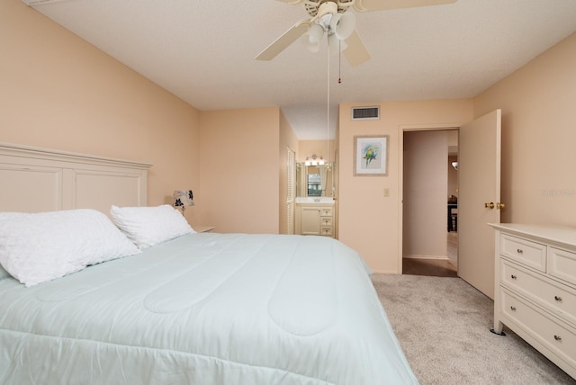 bedroom featuring ceiling fan and light colored carpet