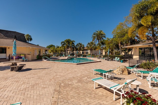 view of swimming pool featuring a patio area