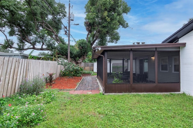 view of yard featuring a sunroom