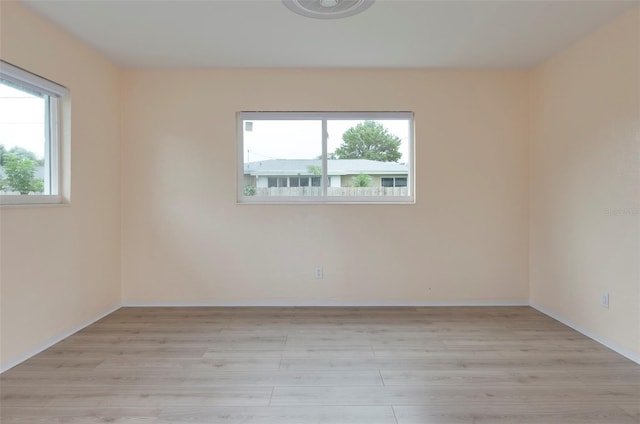 empty room with light wood-type flooring