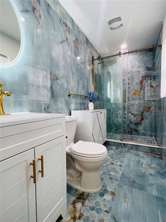 bathroom featuring walk in shower, vanity, tile walls, and toilet