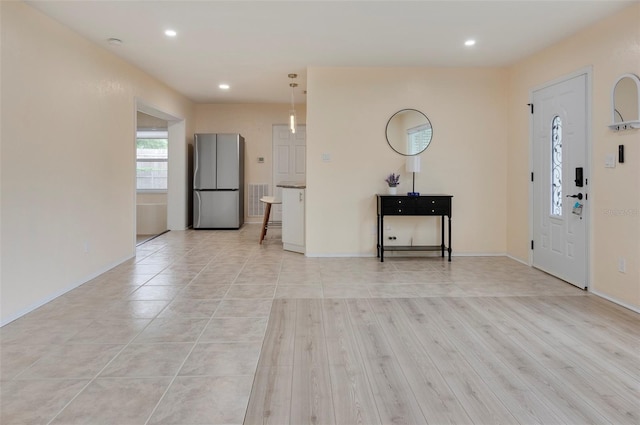 foyer with light hardwood / wood-style flooring