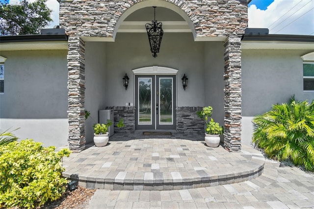 property entrance with french doors and a patio area