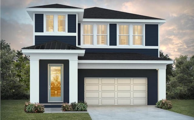 view of front of home with a garage