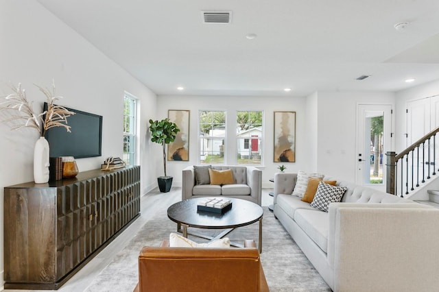 living room with light hardwood / wood-style floors