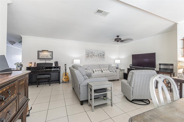 living room with crown molding, light tile patterned flooring, and ceiling fan