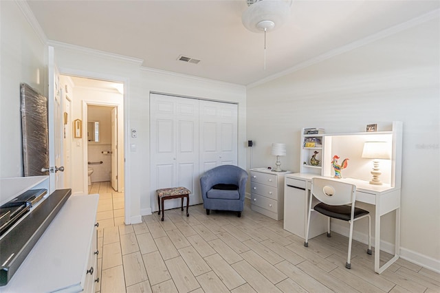 office space featuring light wood-type flooring and crown molding