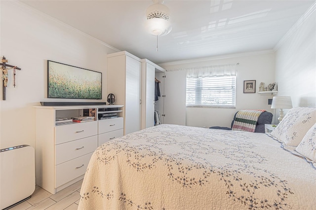 bedroom featuring light hardwood / wood-style flooring and crown molding