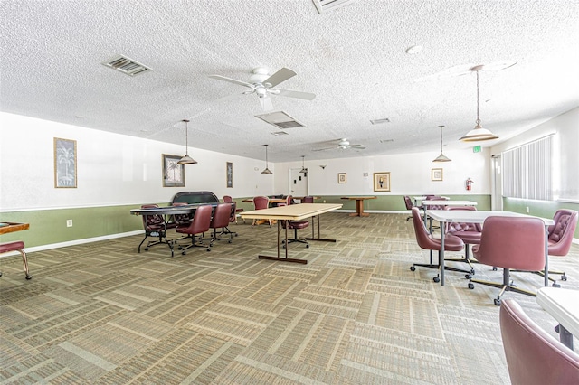 playroom featuring a textured ceiling, carpet flooring, and ceiling fan