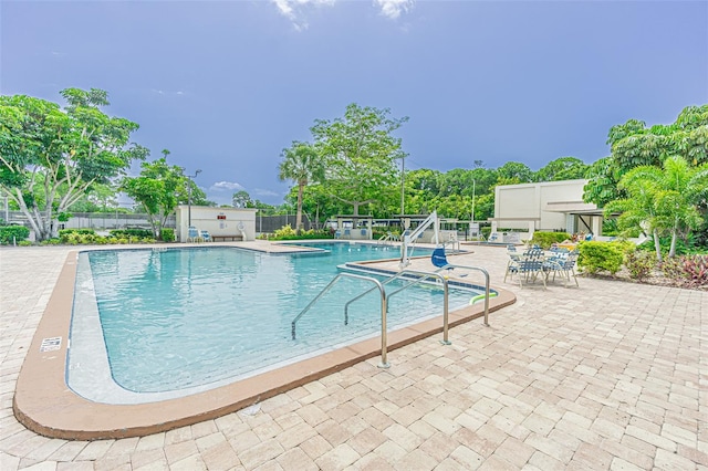 view of swimming pool with a patio area