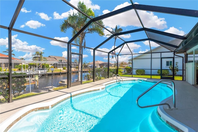 view of swimming pool with a water view, a boat dock, and glass enclosure