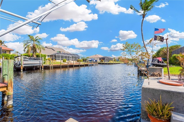 view of dock with a water view and glass enclosure