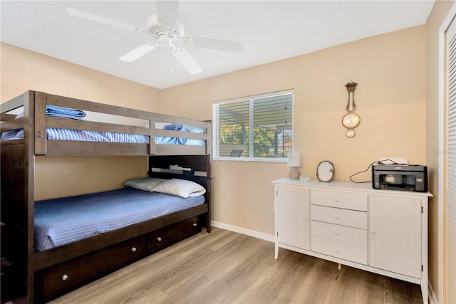 bedroom featuring light hardwood / wood-style flooring and ceiling fan