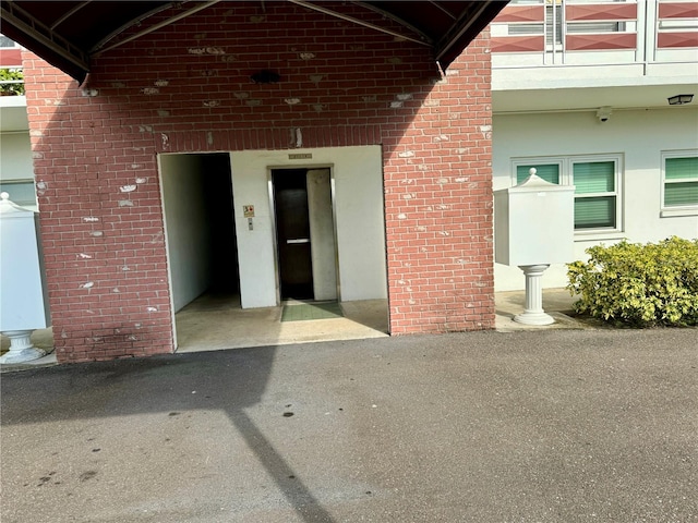 view of exterior entry featuring washer / clothes dryer