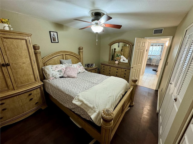 bedroom with ceiling fan and a closet