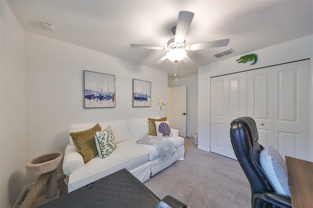 office area with ceiling fan and light colored carpet