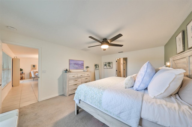 bedroom featuring ceiling fan and light carpet