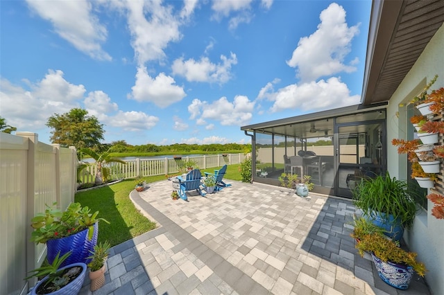 view of patio featuring a sunroom