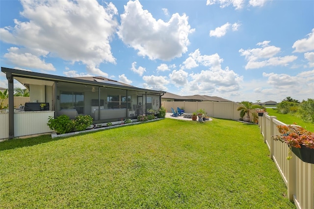 view of yard featuring a patio and a sunroom