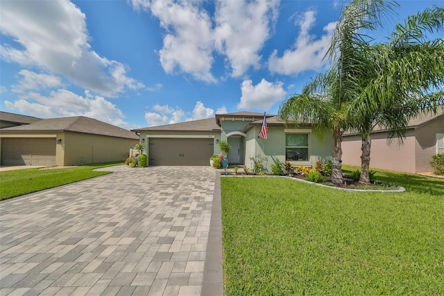 single story home featuring a front yard and a garage