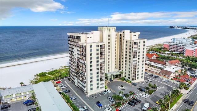 bird's eye view with a water view and a view of the beach